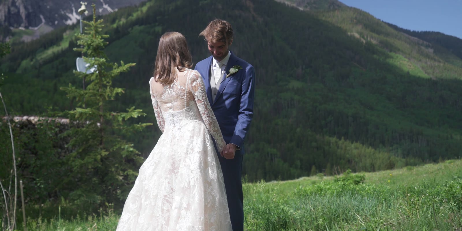 Caroline and Daniel in a green alpine meadow